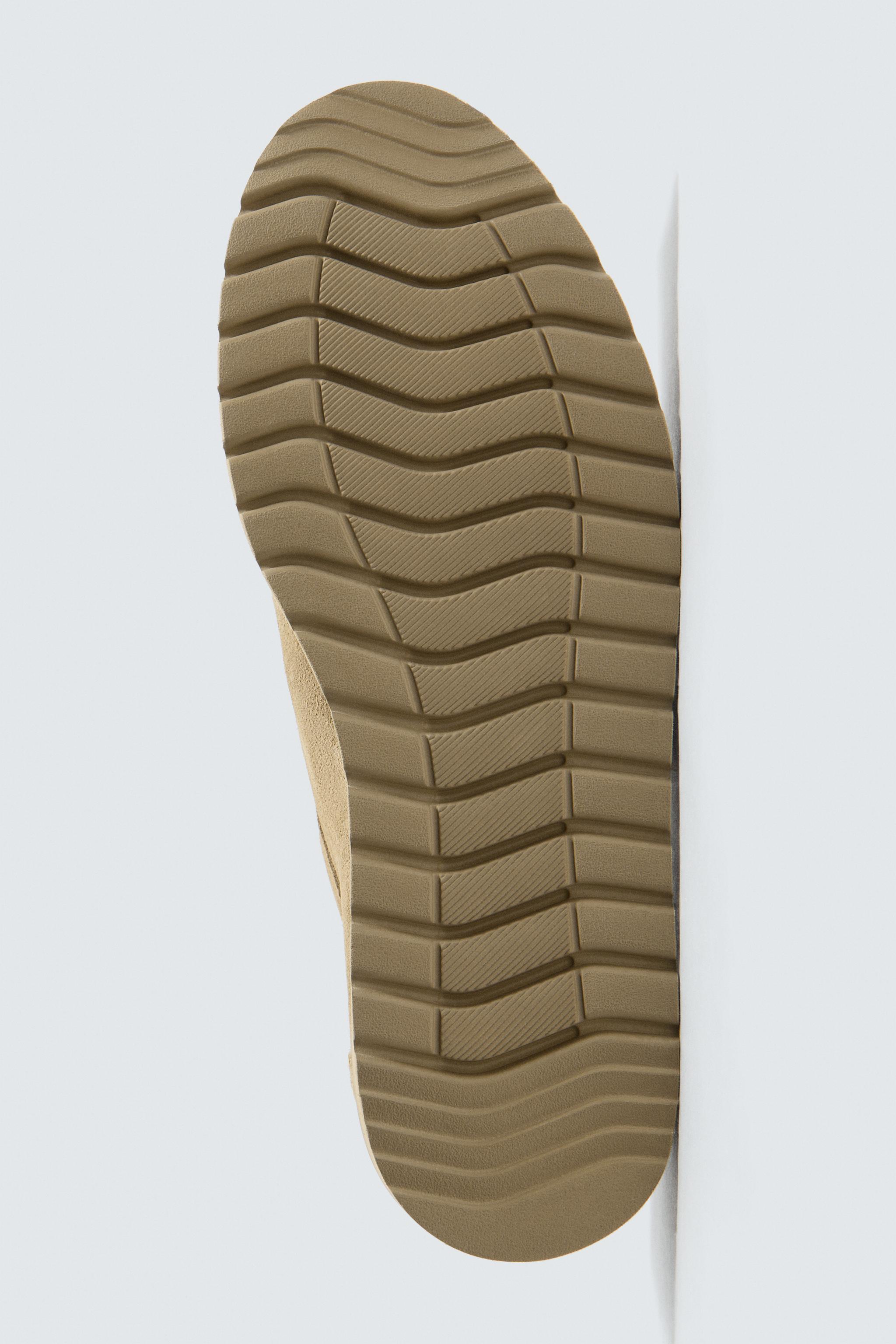 CHAUSSURES EN CUIR BORDÉES